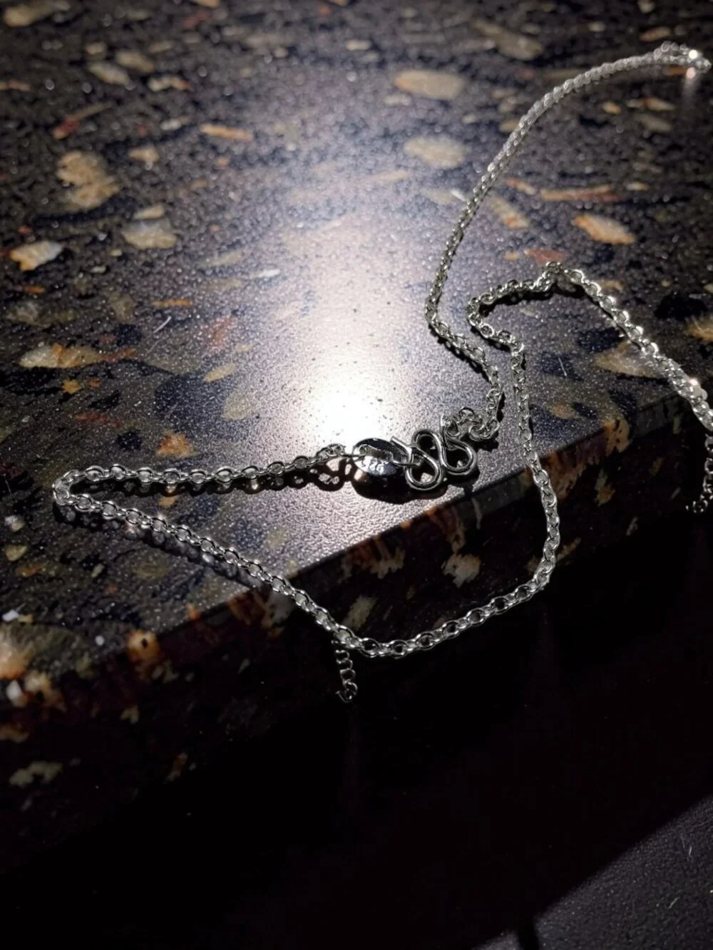 vintage Chrystal lined spiraled curled cross on a .925 sterling necklace